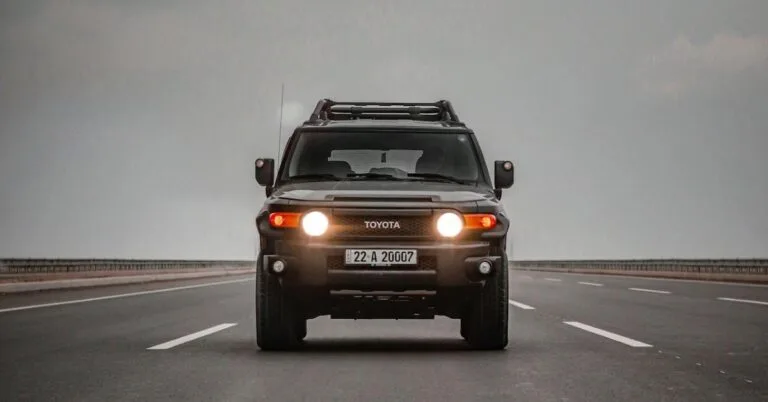 A Toyota SUV on a highway road.